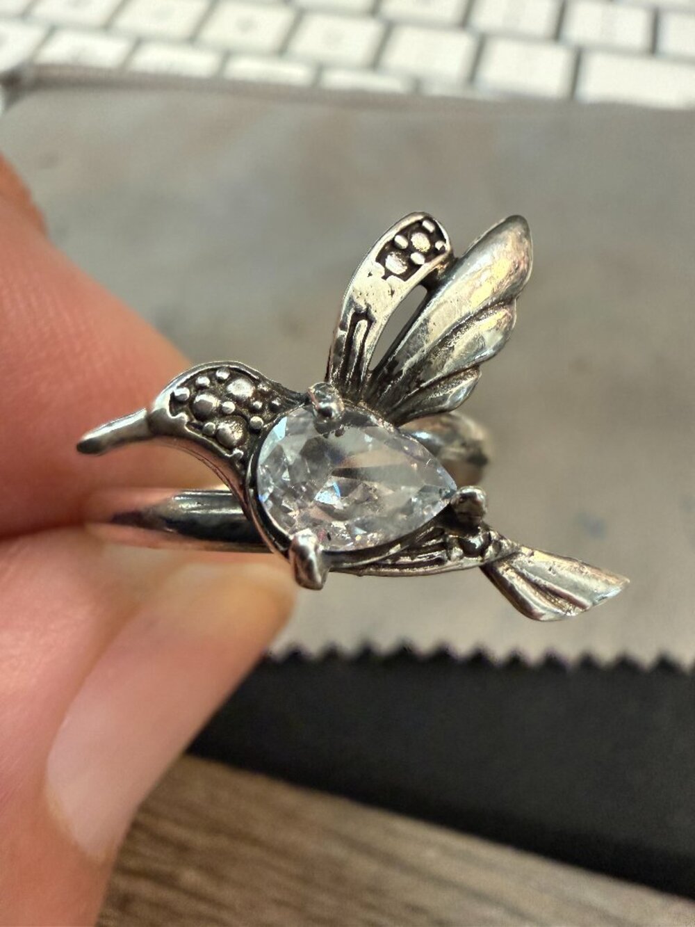 925 sterling silver hummingbird ring featuring a clear pear-shaped stone